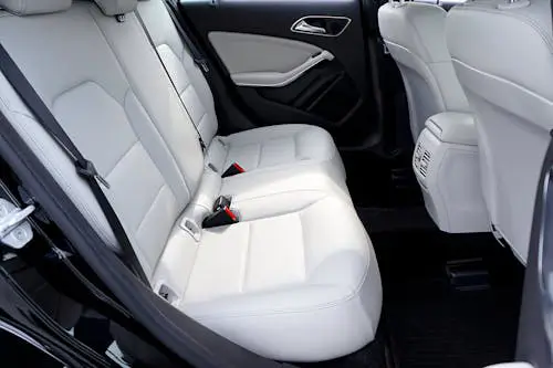 Free Explore the modern and luxurious feel of a car's interior with pristine white leather seats. Stock Photo